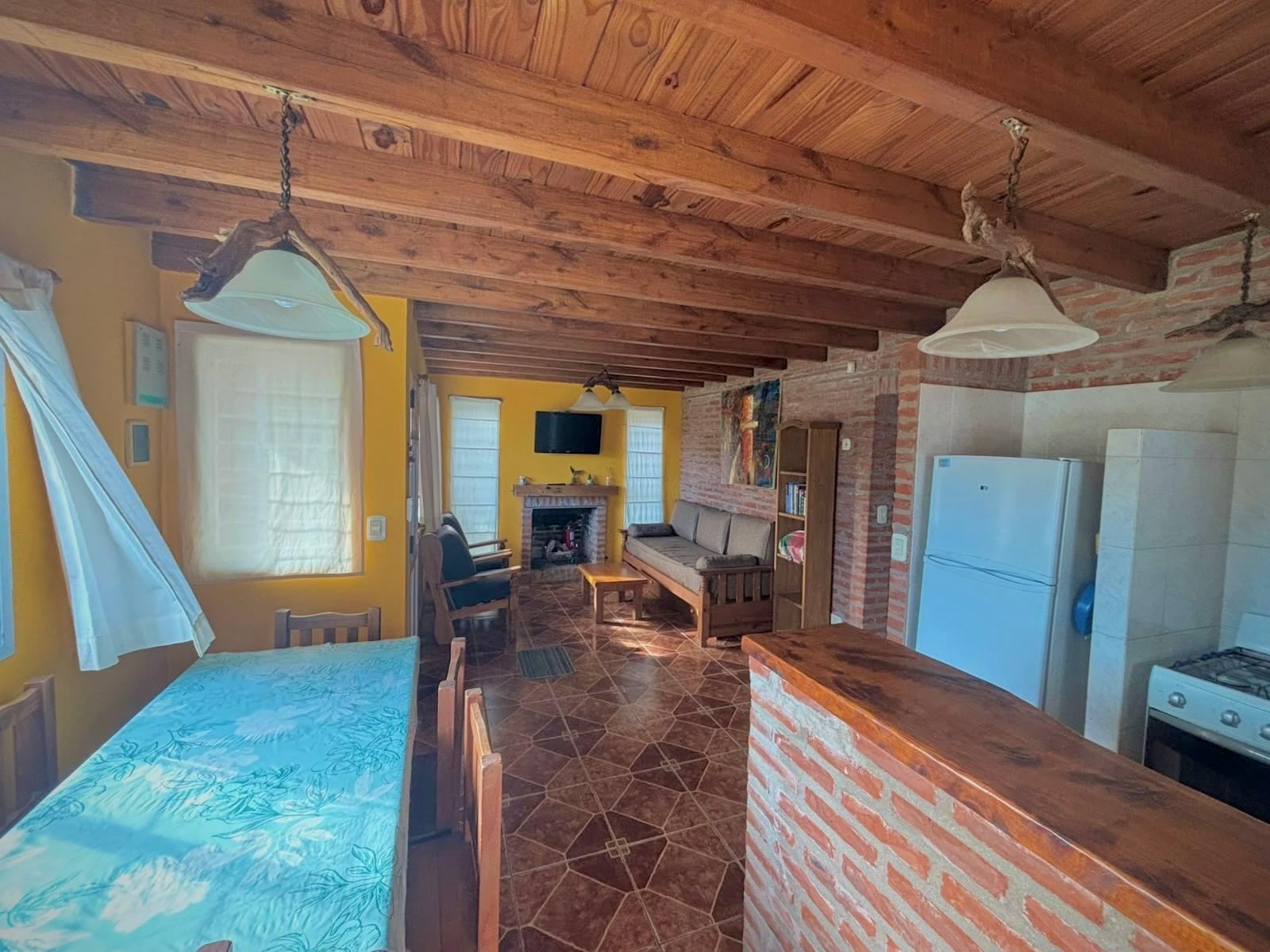 Dining room with fireplace and open kitchen